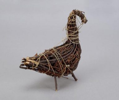 Duck figure made out of vines, sticks, and twigs