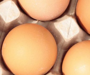 close up shot of brown eggs in a carton