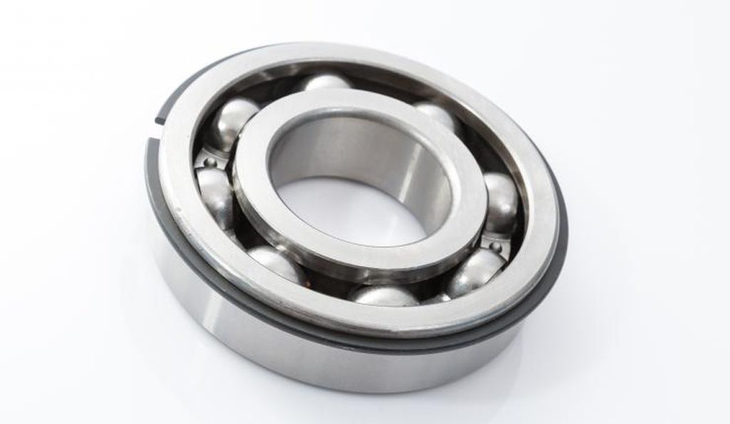 Two metal circles with round metal balls in between (ball bearing)
