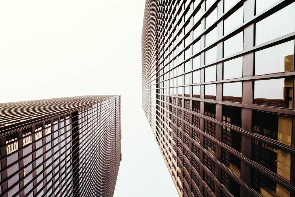 Upward shot of two glass buildings