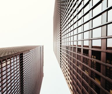 Upward shot of two glass buildings