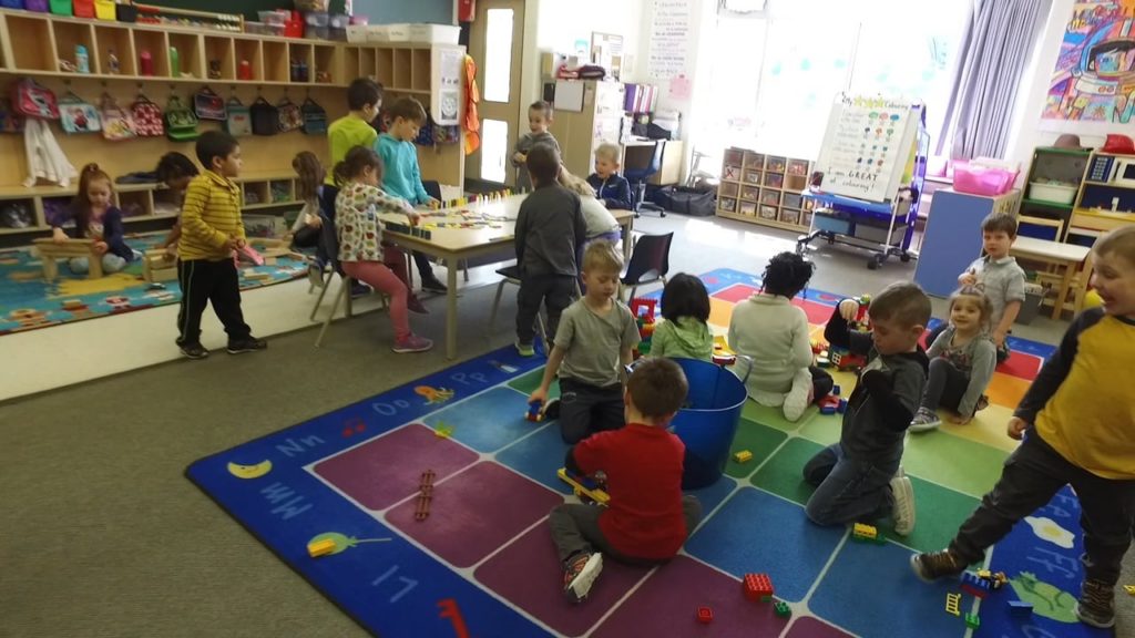 children playing in a classroom