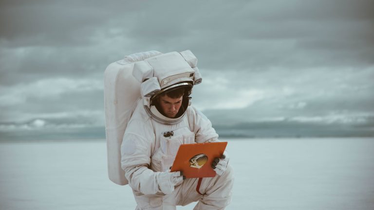 astronaut holding a book