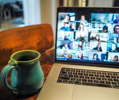 video meeting on laptop and mug