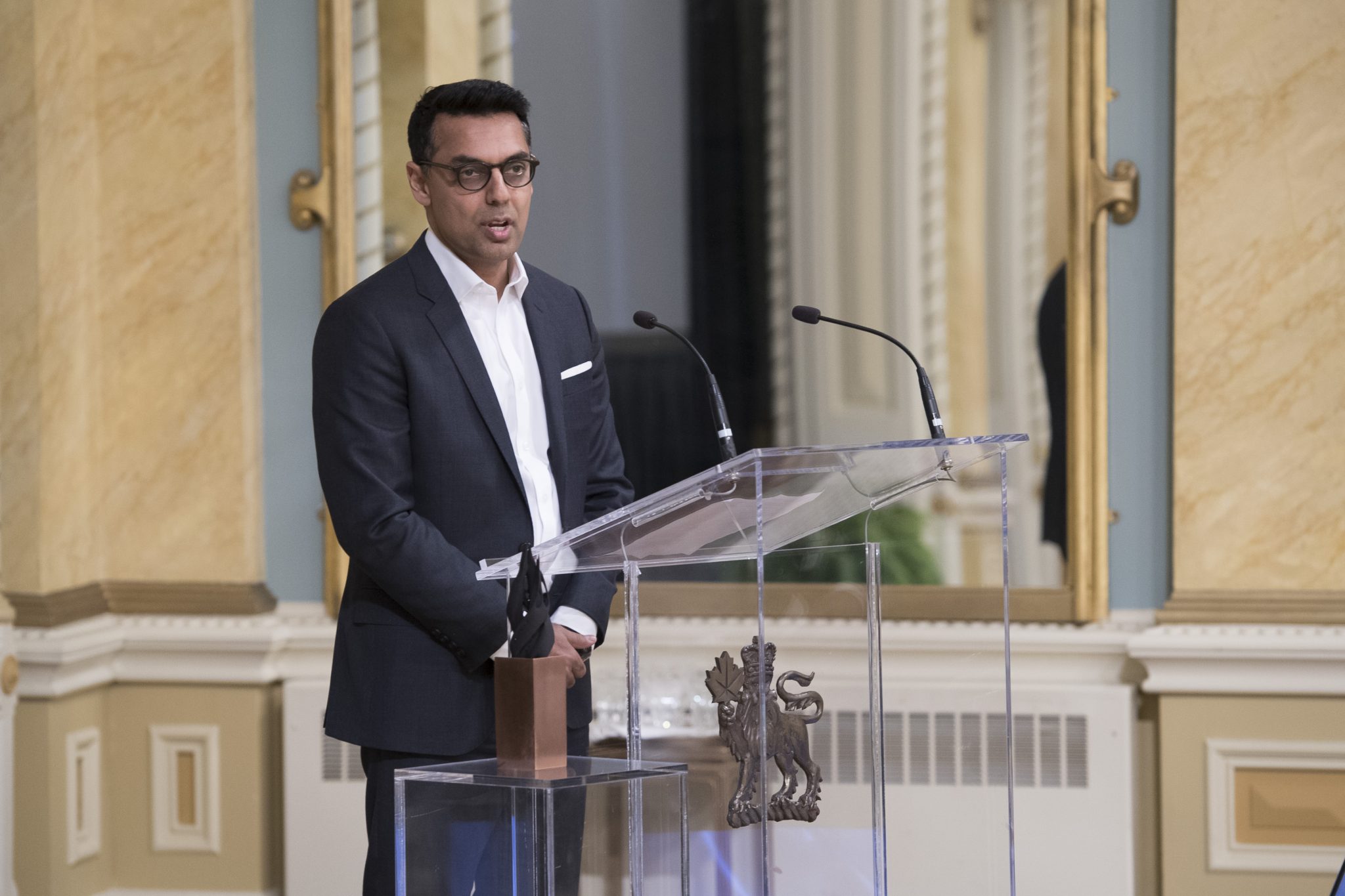 Man standing at podium giving a speech