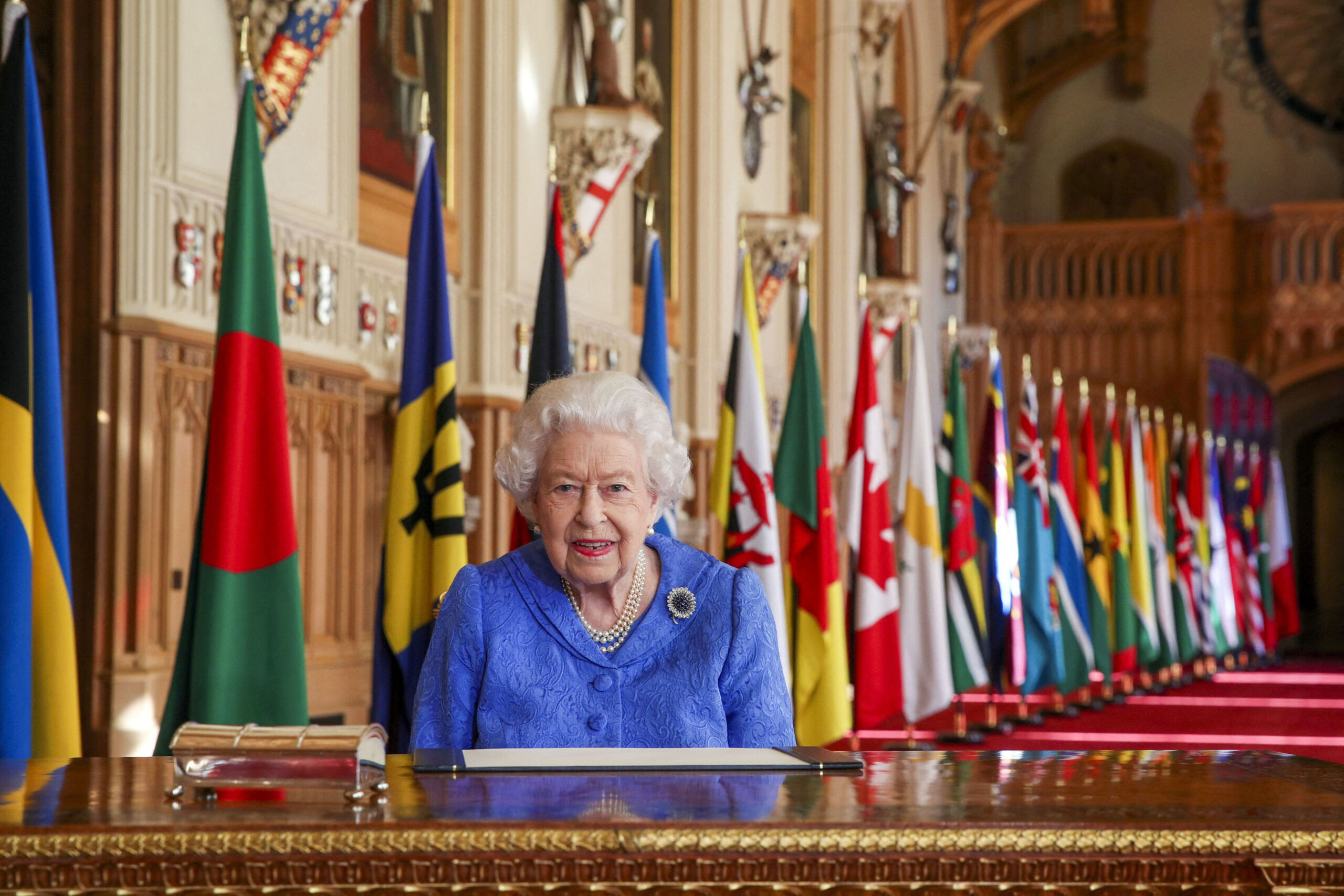 queen headshot with flags behind
