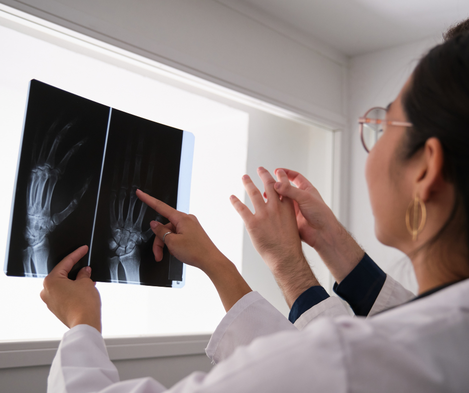 A health professional looking at an x-ray